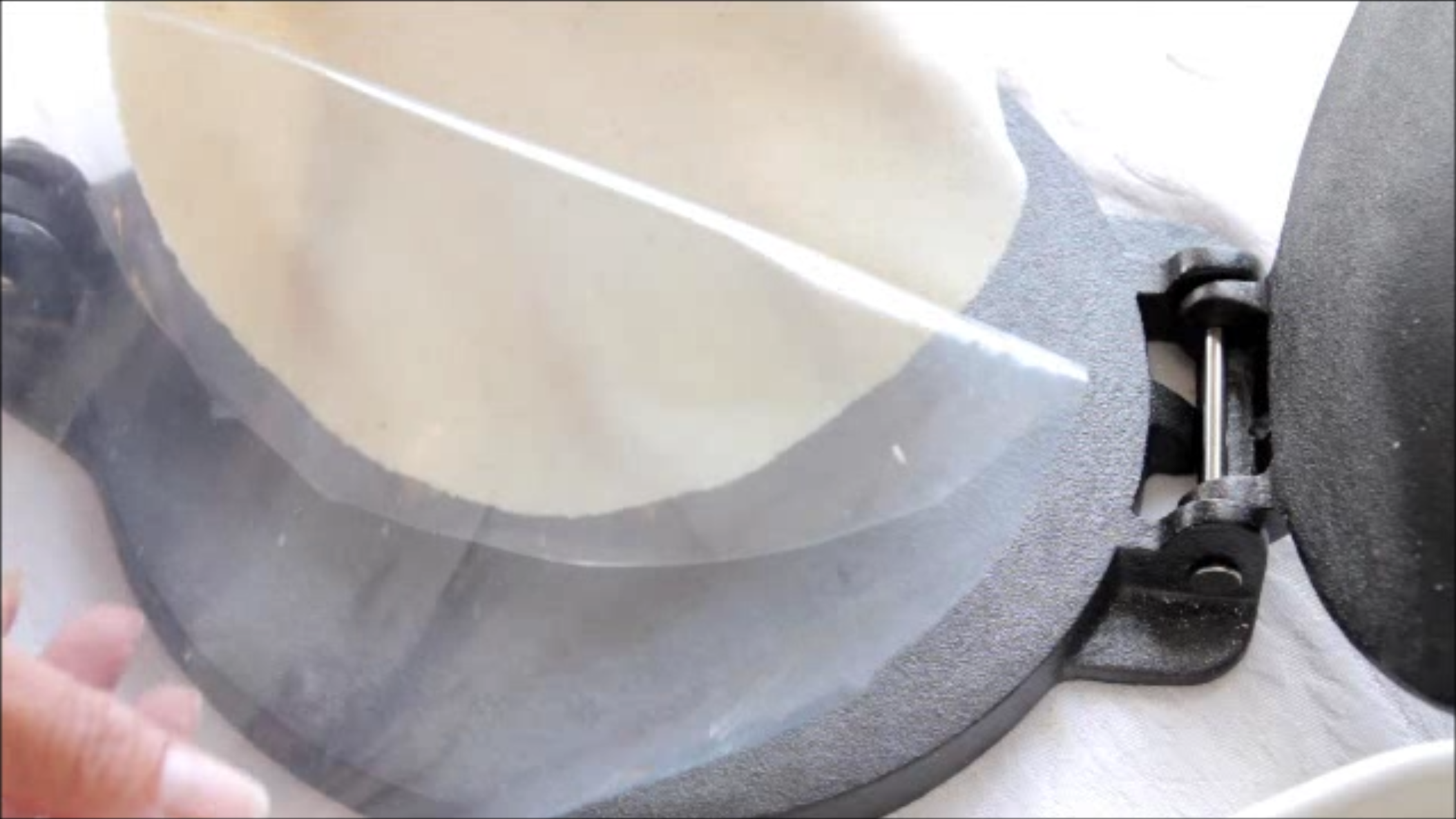 Pick up the tortilla with the bottom plastic and flip it over in your hand. Now gently pull off the plastic. If you want to press out all of the dough balls before beginning to cook, place them on a plate and be sure to separate each one with wax paper or paper towel. This will prevent them from sticking together.