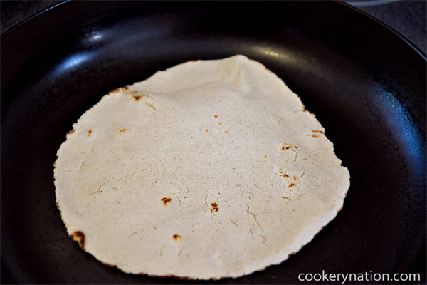 When the underside has browned edges or spots, flip it. Cook for another minute or so.