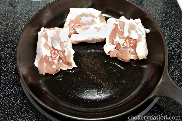 Remove chicken from packaging and place skin side down in a cold frying pan.