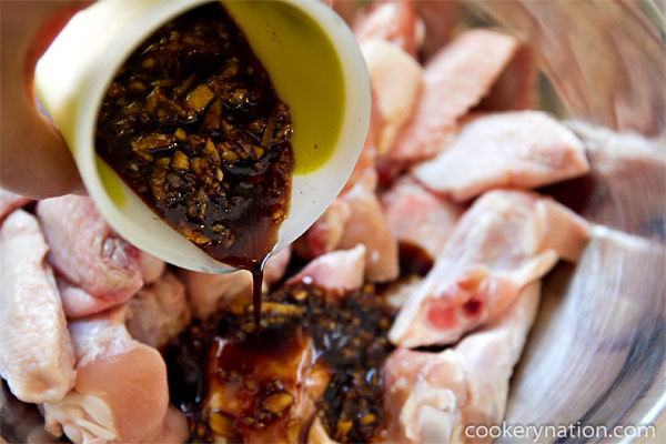 Place chicken in a bowl and pour 1/2 of the wet mixture over the chicken. Stir to combine. Reserve the rest of the sauce for serving with the chicken.